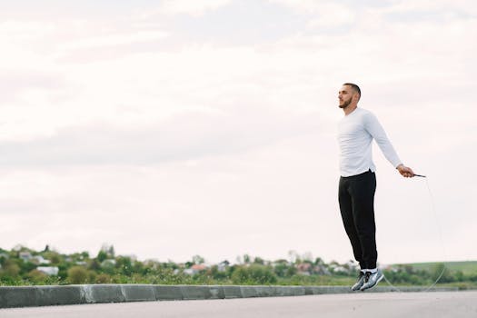 Man performing jump rope exercise outdoors for fitness and healthy lifestyle.